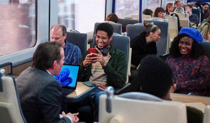 People talk on a train in This is Christmas.
