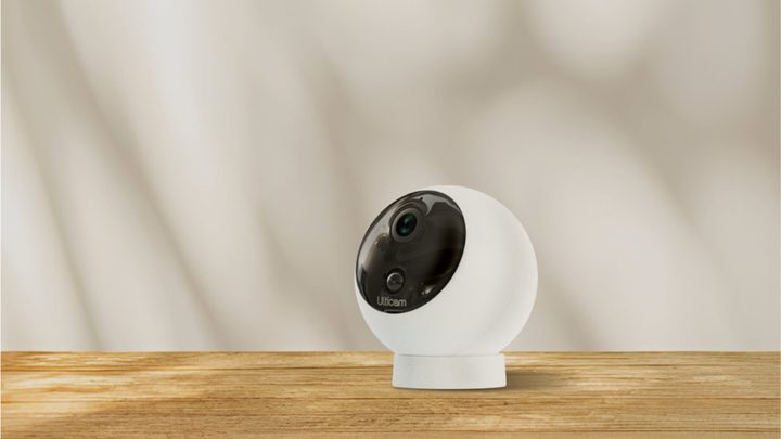 The Ulticam Dot on a wooden table.