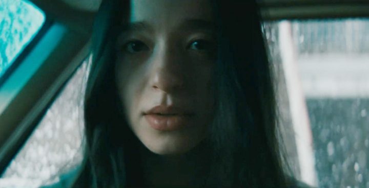 Ani looks at the camera in Anora.