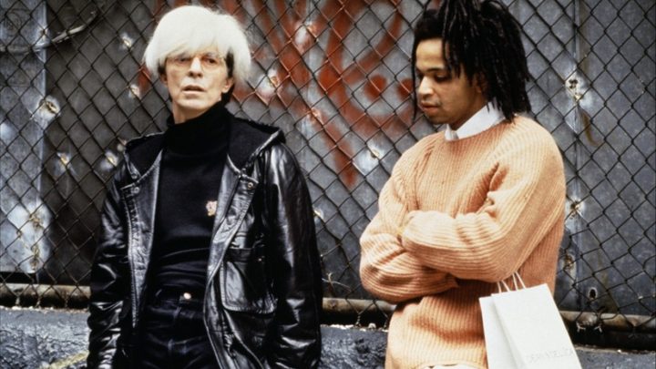 Two men stand outside in Basquiat.