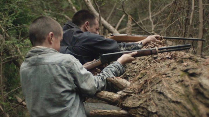 Two brothers aim their guns in Brothers.