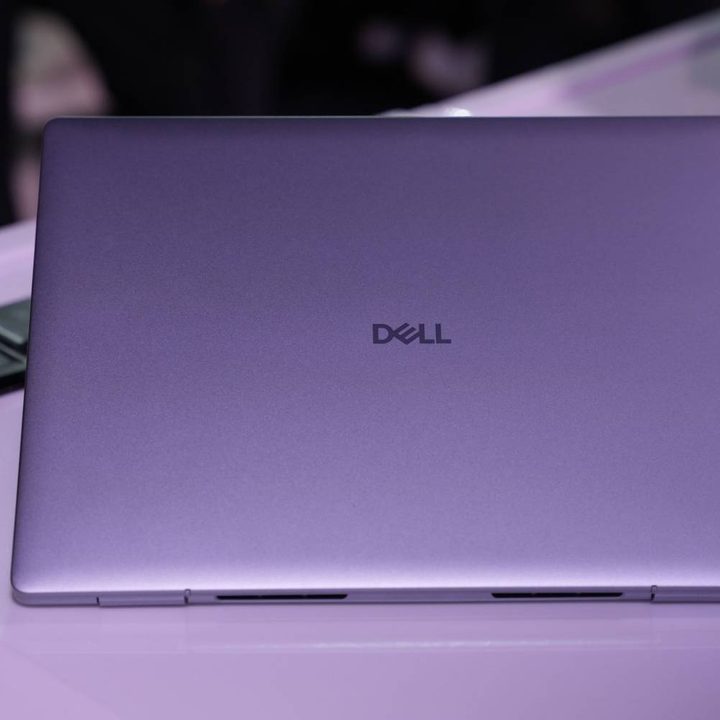 The back lid of the Dell 14 Plus on a table.