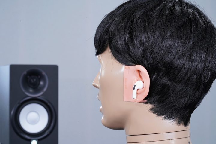 A test mannequin is fitted with Apple AirPods Pro 2. The mannequin is used to evaluate the hearing assistance capabilities of the AirPods Pro 2.