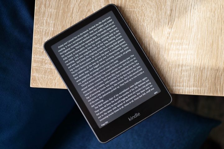 The Amazon Kindle Paperwhite 2024 with Dark Mode active on a book page.