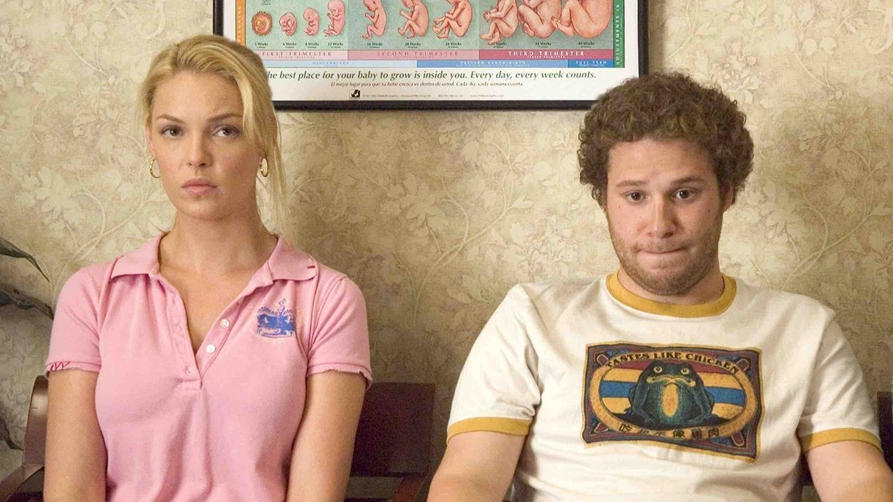 Katherine Heigl and Seth Rogen sitting awkwardly together in a waiting room in Knocked Up.