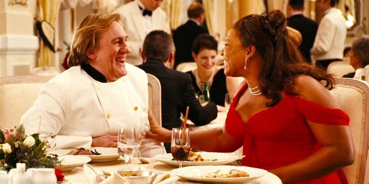 A woman smiles at a chef in Last Holiday.