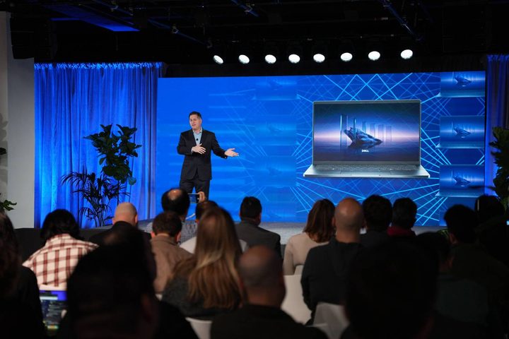 Michael Dell standing on stage at a Dell event.