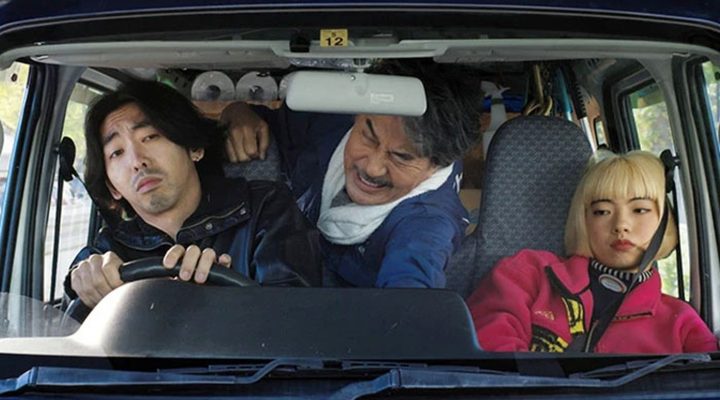 Three people ride in a van in Perfect Days.