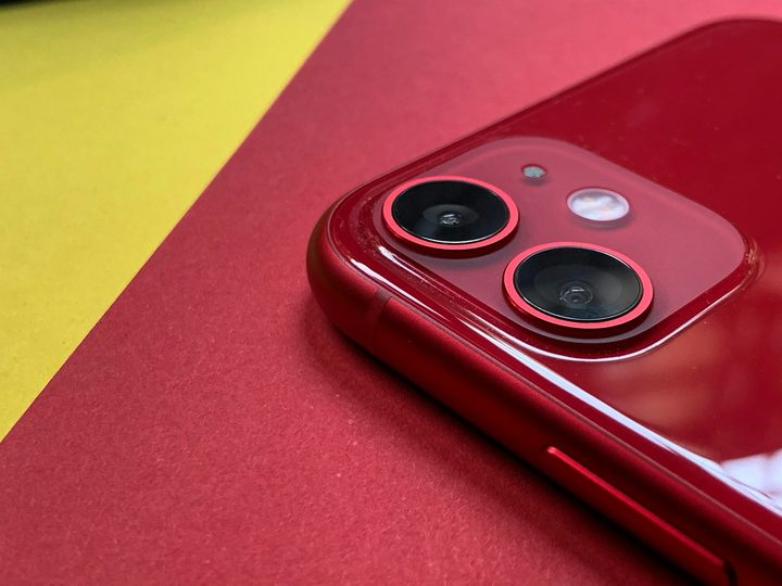 Red phone on colorful background.