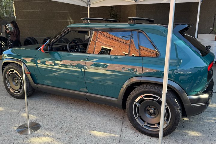 A green Rivian R3X.