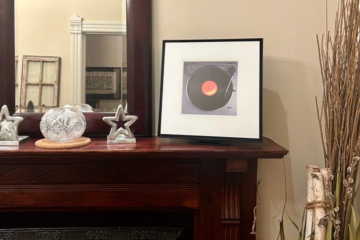 Samsung Music Frame on mantel.