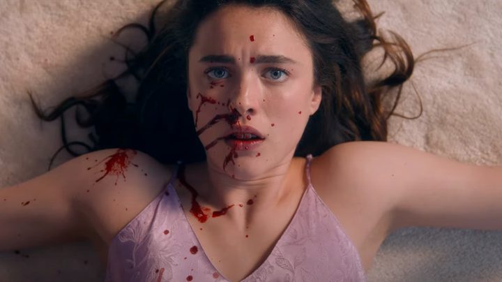 A young girl has blood on her face in The Substance.
