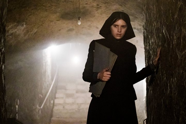 A nun walks in a tunnel in The First Omen.