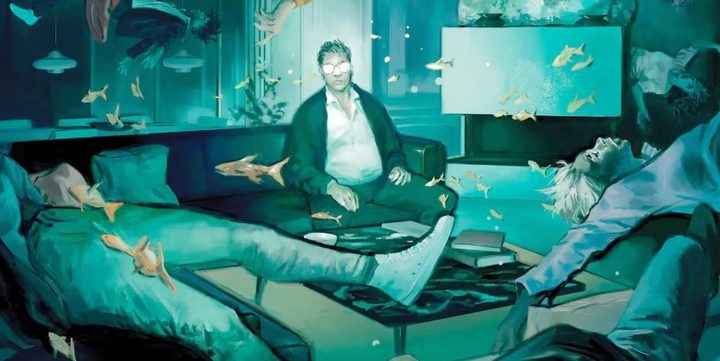 A man sits in a living room in The Nice House by the Lake.