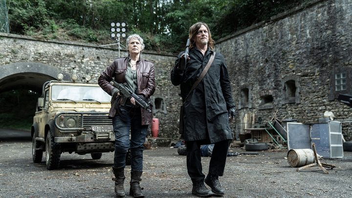 Carol and Daryl walk with guns in The Walking Dead: Daryl Dixon - The Book of Carol.