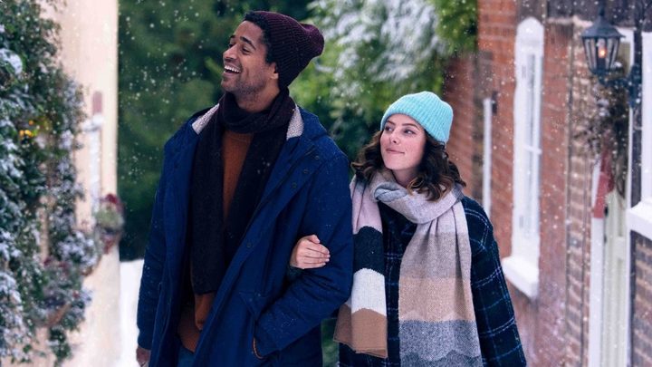 A couple walks in the snow in This is Christmas.