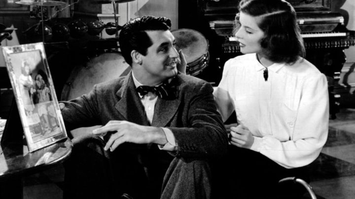 Cary Grant and Katharine Hepburn as Johnny and Linda looking at each other in Holiday.