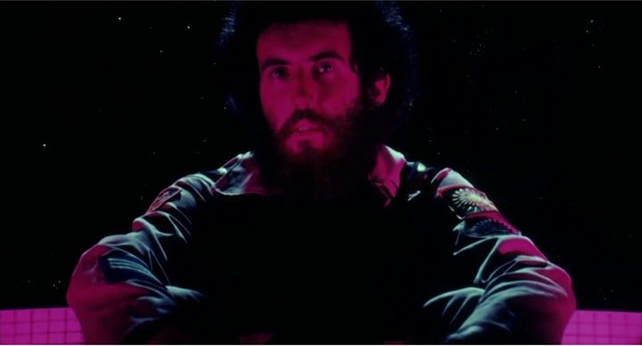 Close-up of a man lit by purple lighting in Dark Star.