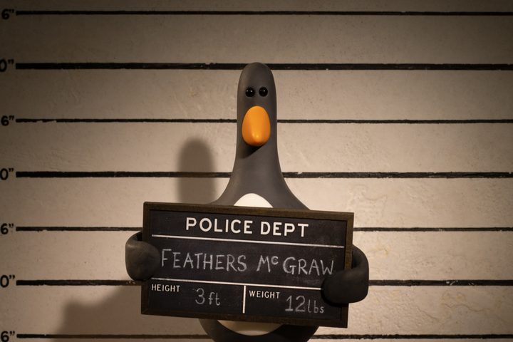 Feathers McGraw poses for his mugshot in Wallace & Gromit: Vengeance Most Fowl.