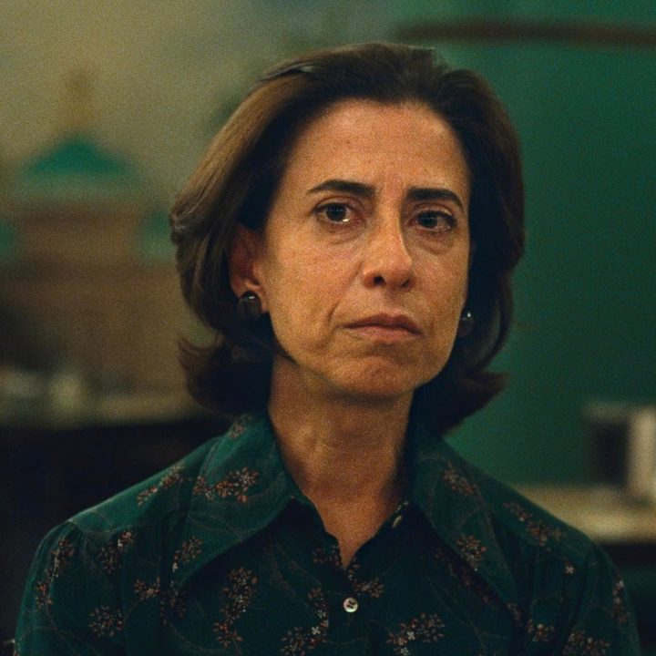 Fernanda Torres sits and stares in a film from the movie I'm Still Here.