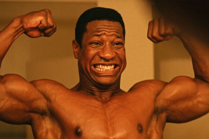 Jonathan Majors flexes his muscles into the mirror in Magazine Dreams.