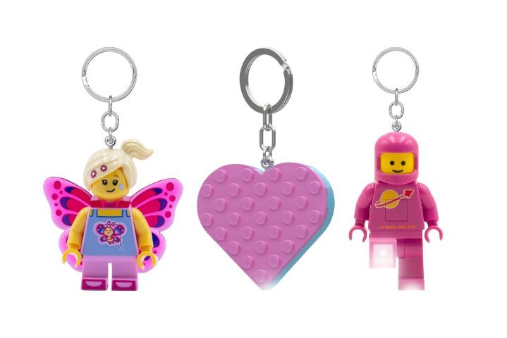 three lego keychains in pink