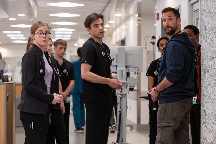 Patrick Ball stands next to Noah Wyle in The Pitt.