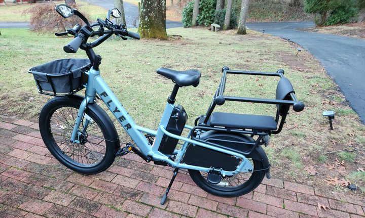 Radio Flyer Flex e-bike with optional passenger or cargo hopper and wide foot pegs.
