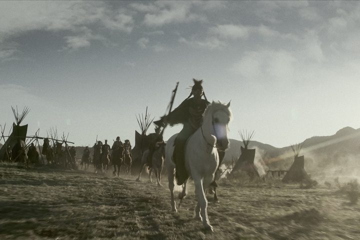 Red Feather rides a horse in American Primeval.