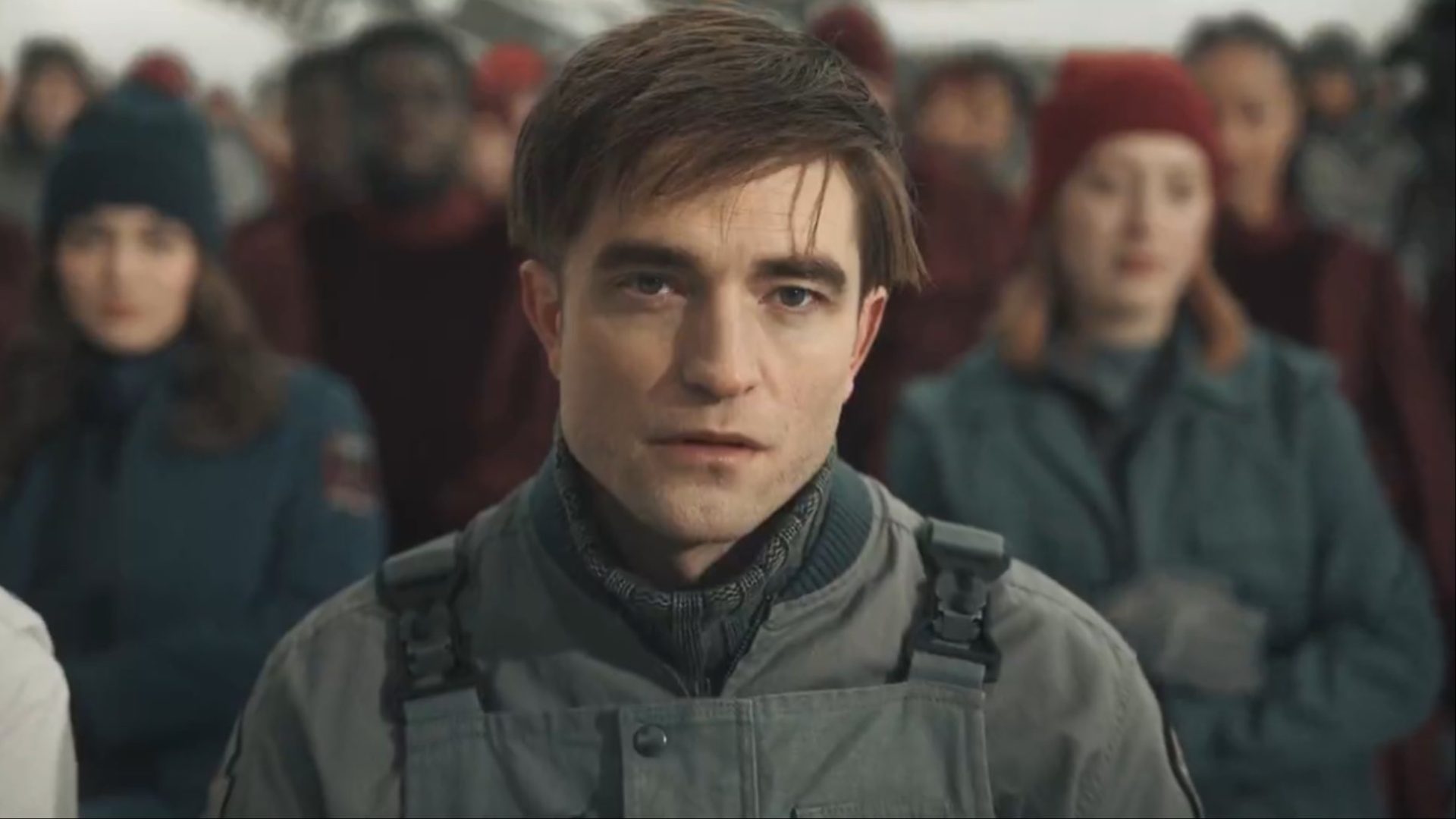 Robert Pattinson stares with a confused look in Mickey 17.