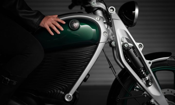 Royal Enfield Flying Flea brand FFC6 with a rider in the seat view of tank area and front fork right side view.