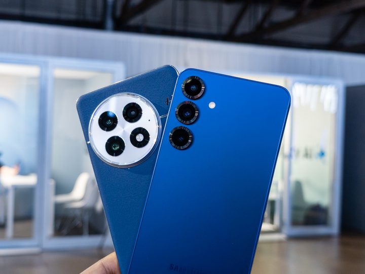 The Galaxy S25 Plus in Navy vs the OnePlus 13 in Blue