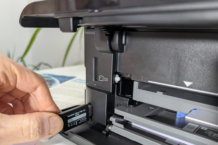 The USB port and SD card slots are on the front of the Expression Photo XP-8800 behind the panels.