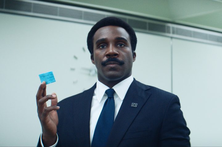 Tramell Tillman holds a post-it note in Severance season 2.