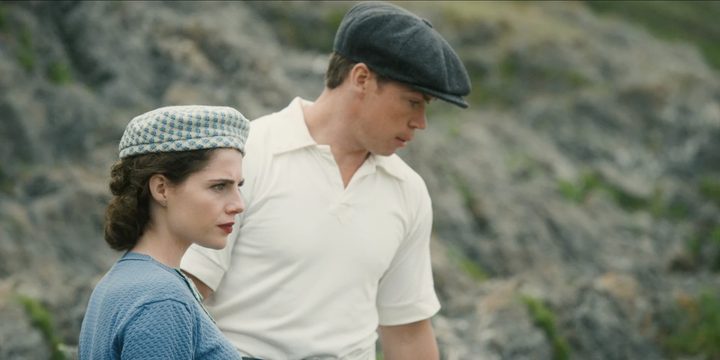 Two people look down a cliff in Why Didn't They Ask Evans?