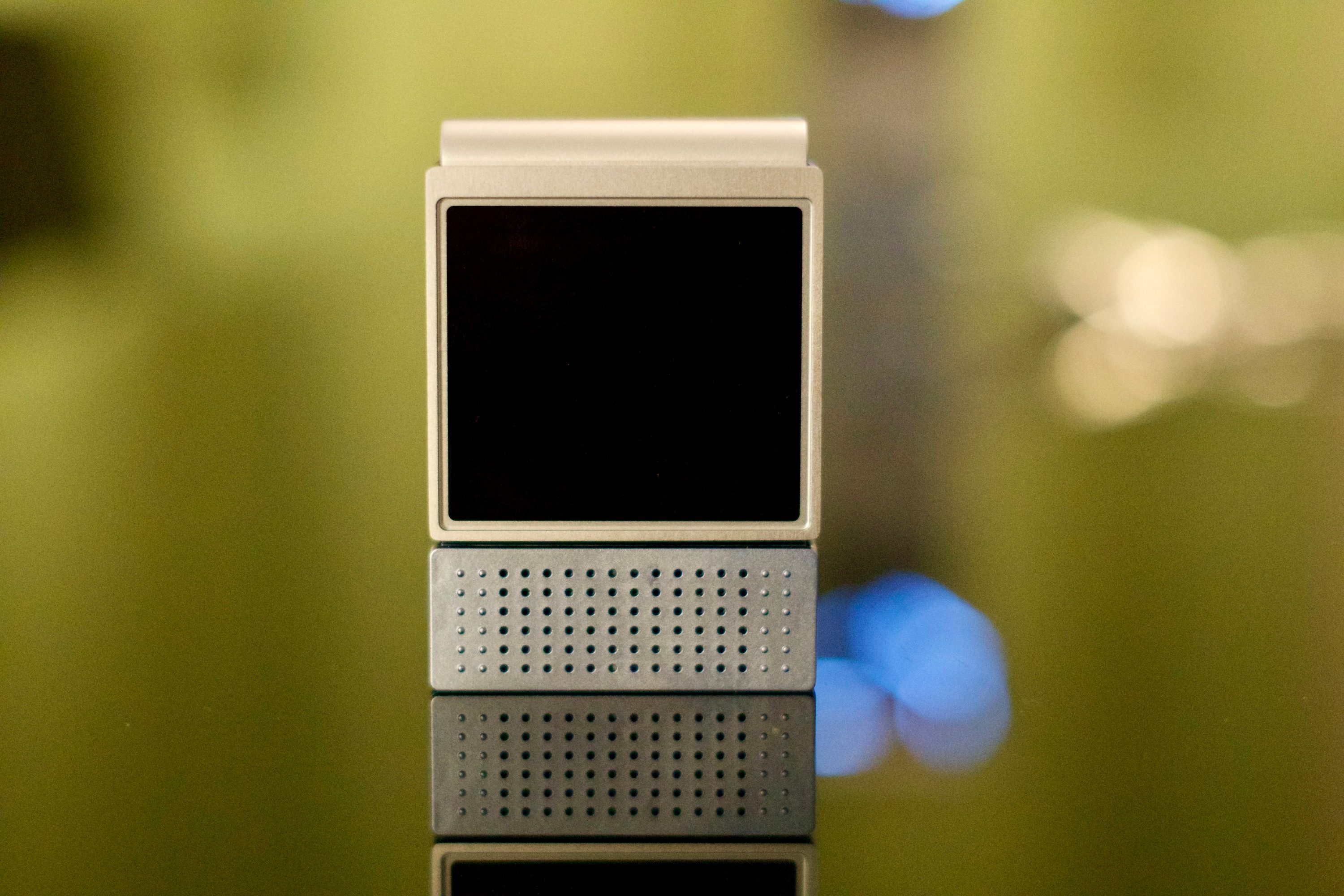 The Amazfit V1tal sitting on a table with its screen off.