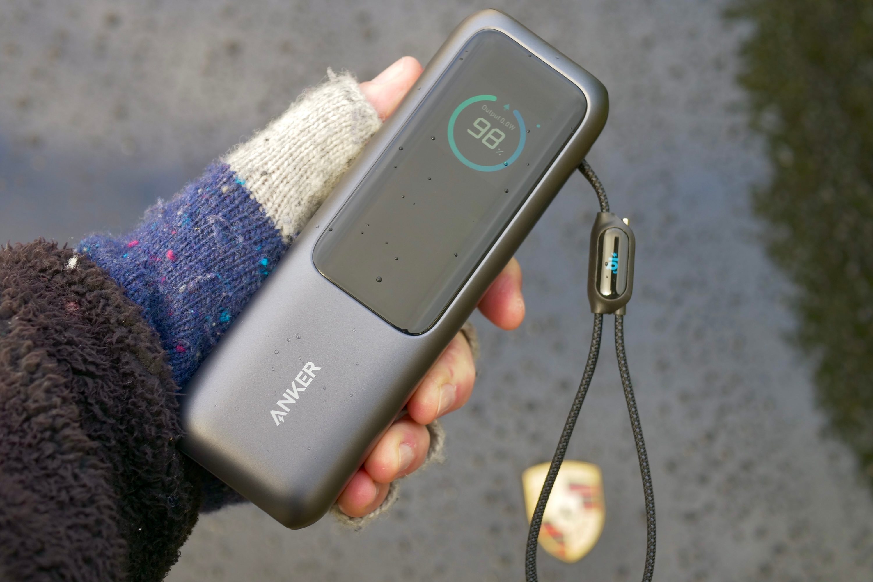 A person holding the Anker 165W Power Bank.