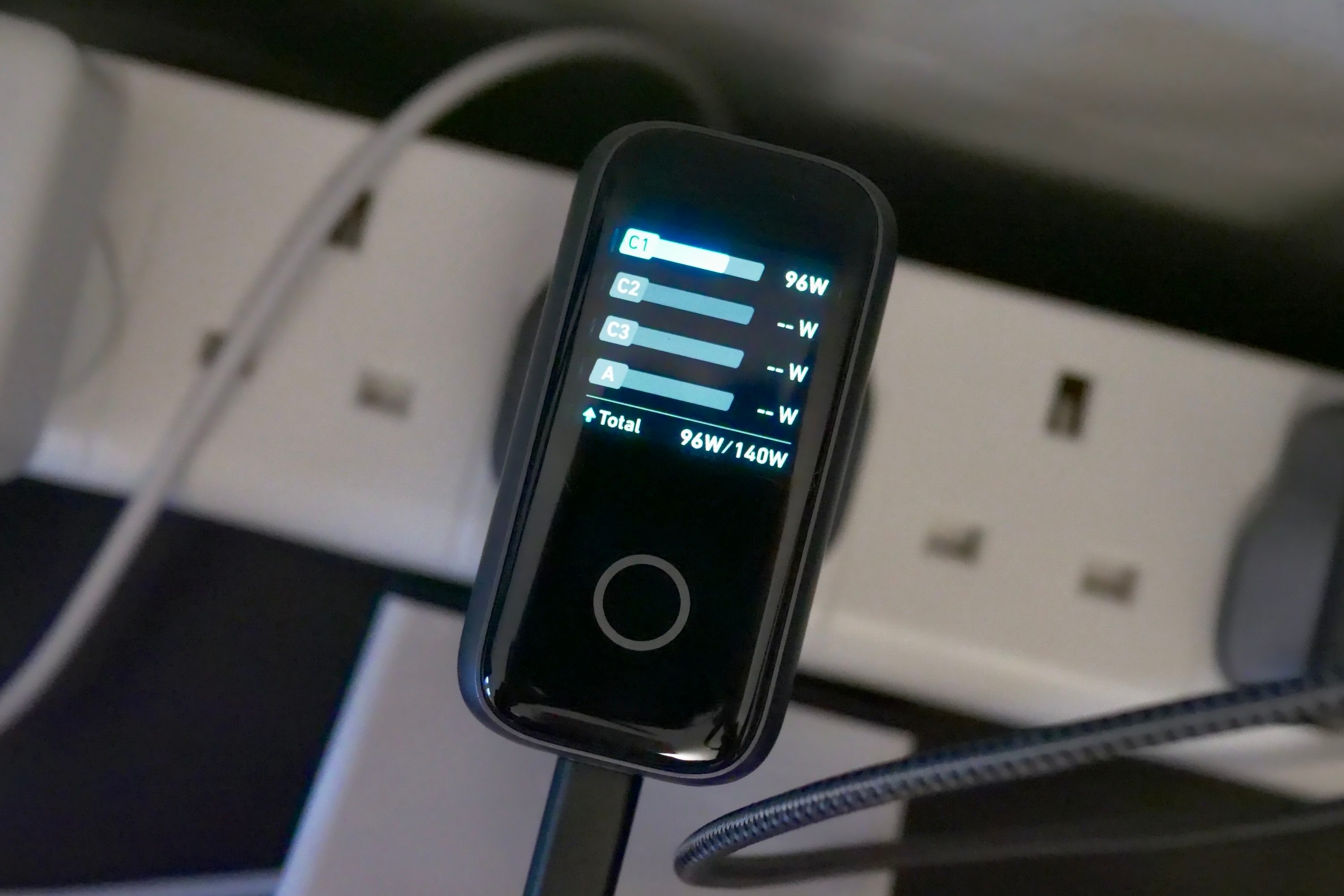 The Anker 140W Wall Charger showing charging speeds.