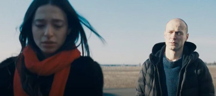 A man looks at a woman in Anora.