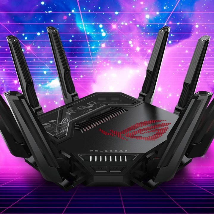 An Asus Rapture GT BE98 Pro router over a galactic background.
