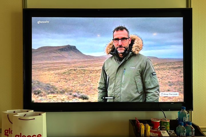 An AI-generated image of Simon Cohen on a GlanceTV screen.
