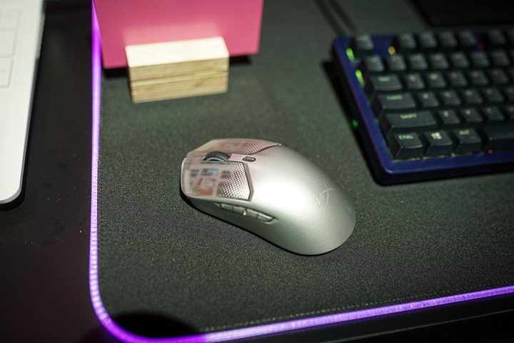 The HyperX Saga Pro mouse sitting on a mousepad.