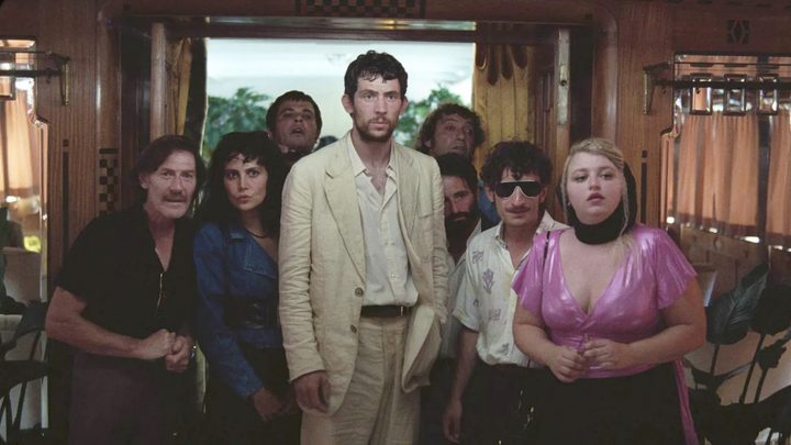 A man stands with a group of people in La Chimera.