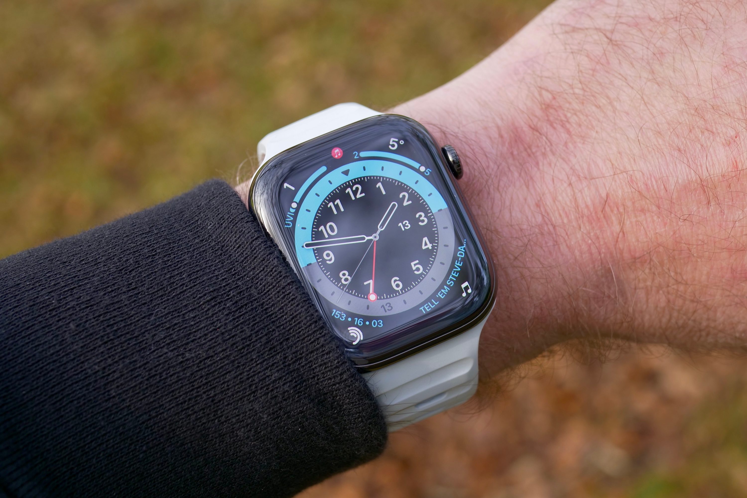 A person wearing the Nomad Sport Band in the Icy Blue glow-in-the-dark finish.