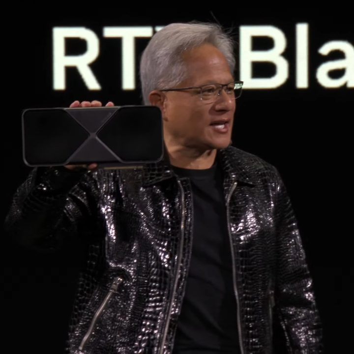 Nvidia's CEO Jensen Huang showing off the RTX 5090 at CES 2025.