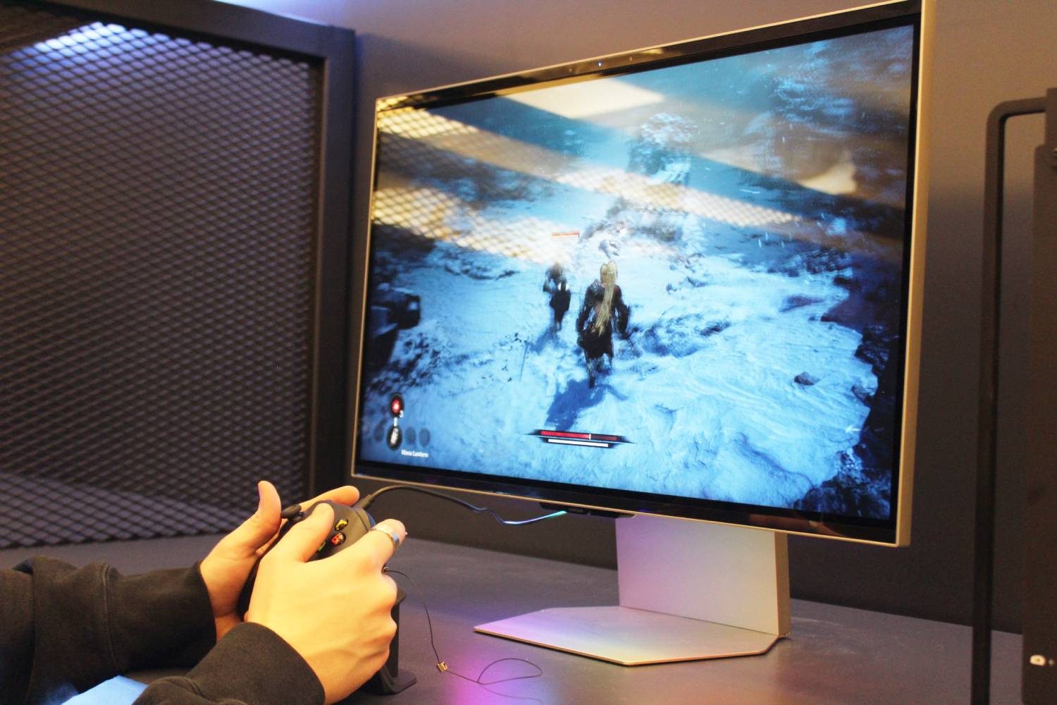 Someone playing a game on the Samsung Odyssey 3D gaminjg monitor.