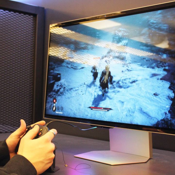 Someone playing a game on the Samsung Odyssey 3D gaming monitor.