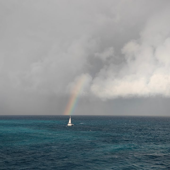 A photo of a ship with a rainbow in the background, taken with the OnePlus 13R.