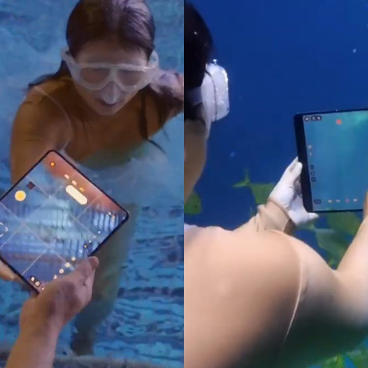 Person using the Oppo Find N5 underwater.