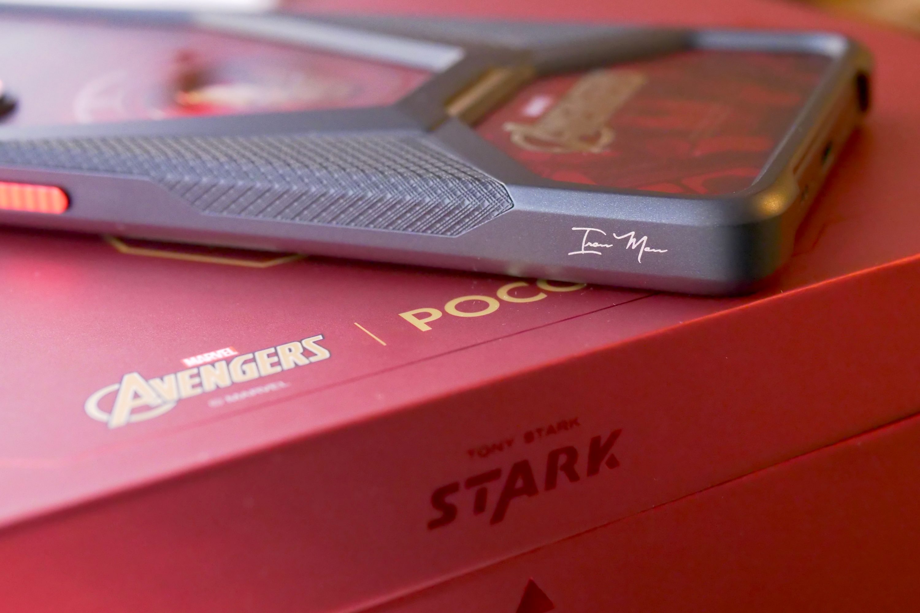 The Iron Man signature on the Poco X7 Pro - Iron Man Edition's case.